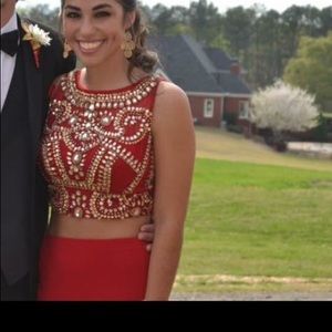 Red two piece bejeweled prom dress.